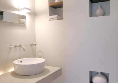 Chicago apartment, modern powder room, limestone slab benchtop, wall niche, Stark Design